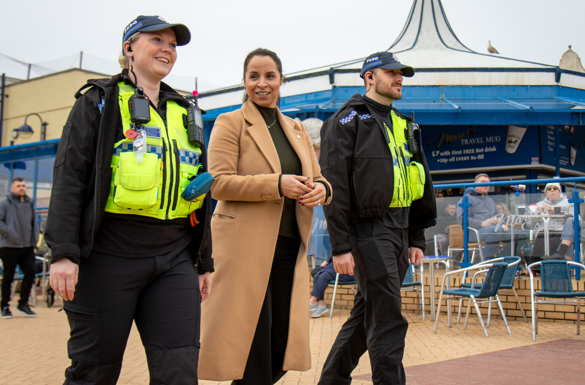 Picture of Police & Crime Commissioner, Emma Wools with PCSOs walking in Barry Island
