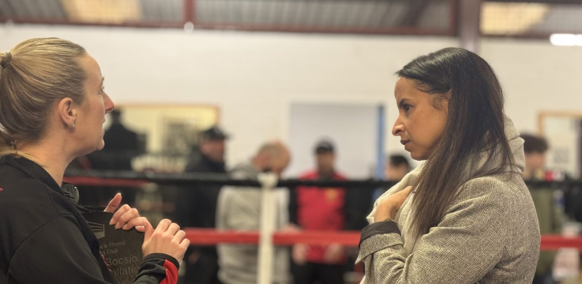 Picture of the Police & crime Commissioner, Emma Wools at caerau Ely boxing gym speaking to community members