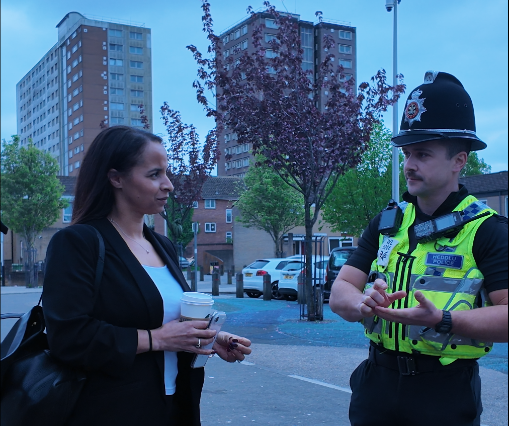 Picture of the Police & Crime Commissioner speaking with a police officer in Butetown